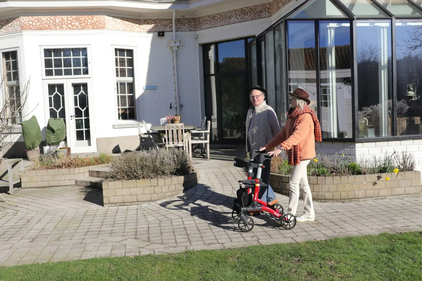 Residents enjoying the outdoors with a caregiver